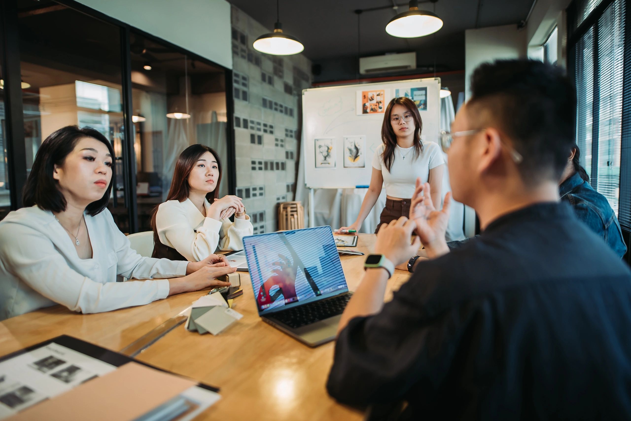 Creative team listening during a marketing presentation