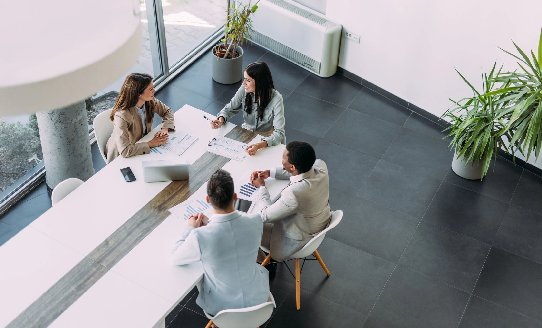 Business team in strategy meeting viewed from above