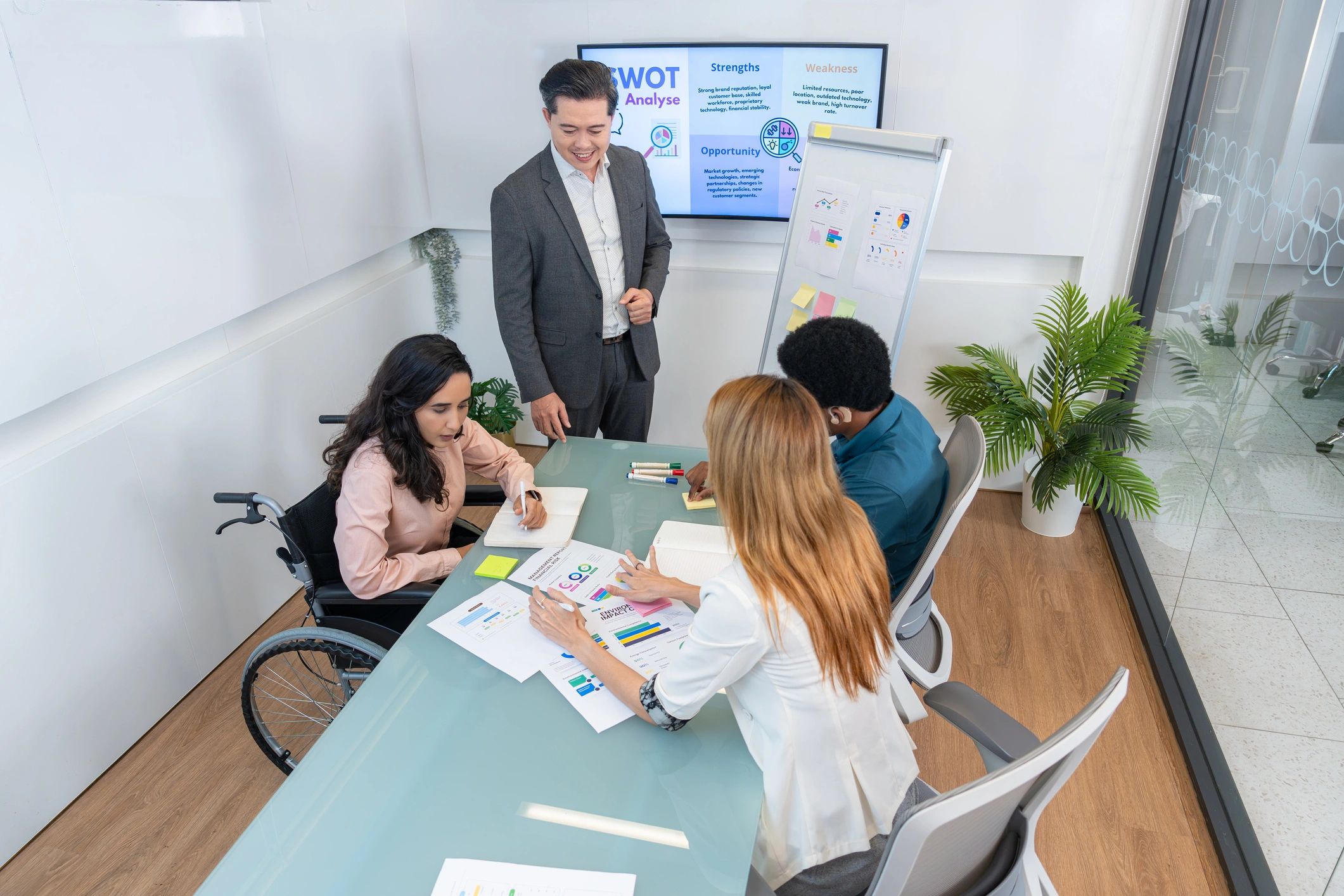 Marketing team reviewing analytics and search performance in a modern meeting room