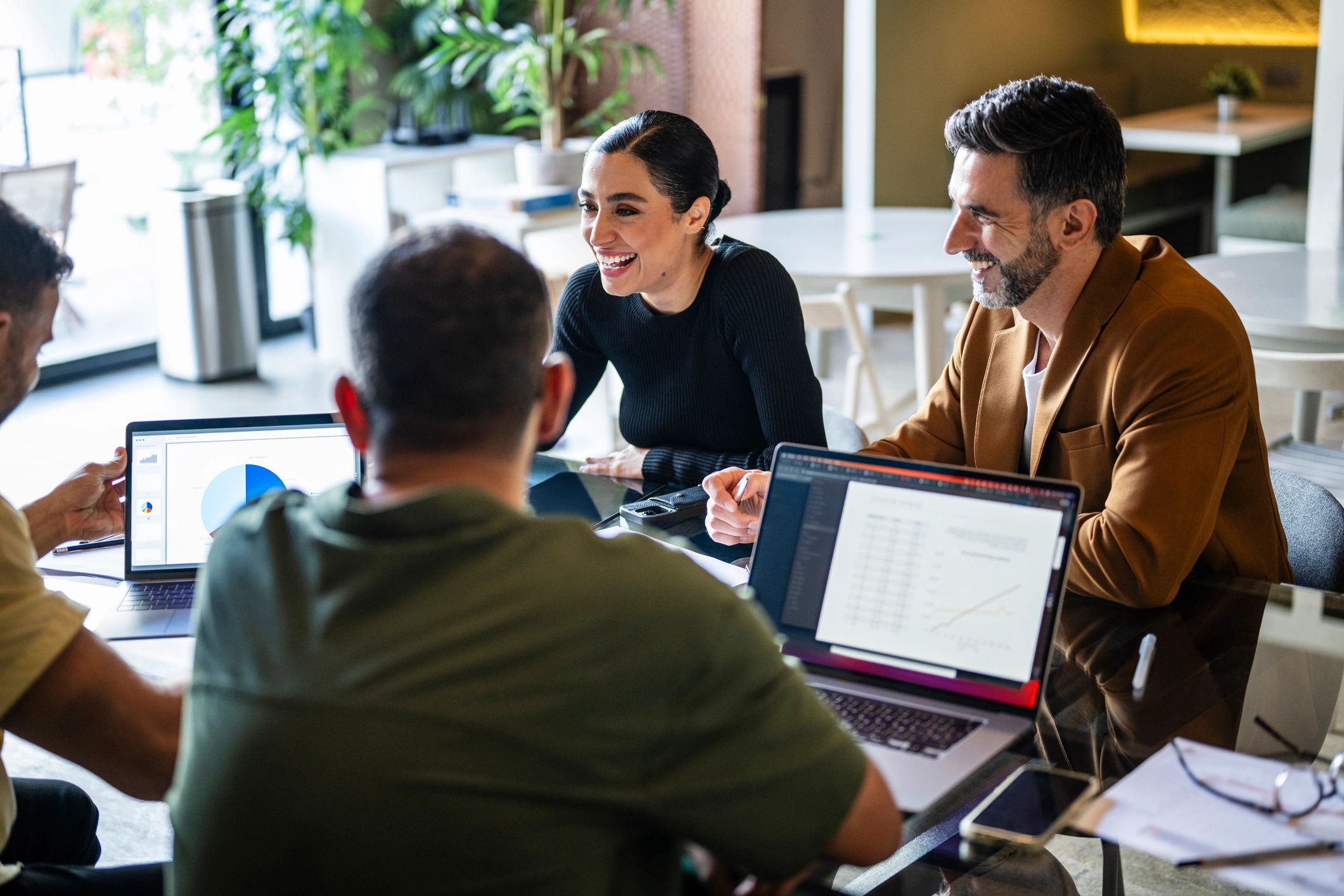 Marketing team reviewing campaign strategy in a meeting